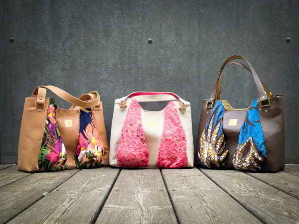  3 shoulder bags with breasts on the front
