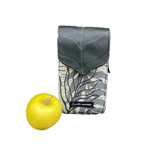 A companion made from a gray, navy blue, and yellow babywearing wrap with bird motifs and sun-yellow faux leather.
