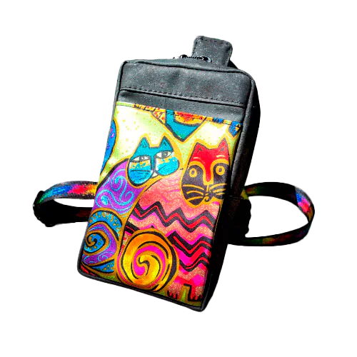 A small backpack made of matte black cork and a silk scarf with a colorful cat pattern, with a black and rainbow adjustable strap.