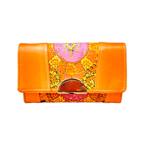 A wallet made of orange lambskin leather and vintage multicolored rayon, in shades of orange, yellow, and pink.