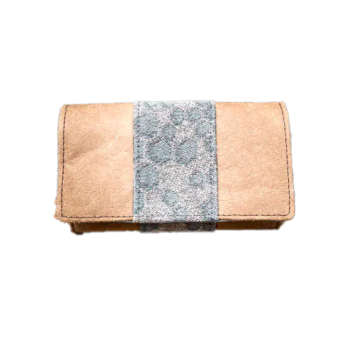 A wallet made of brown washable paper and a gray babywearing wrap with a hive pattern.