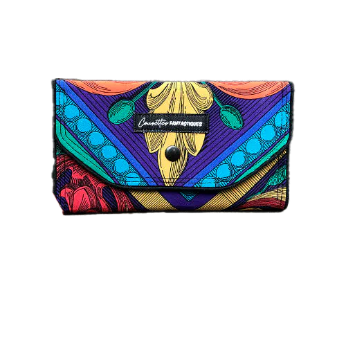 A wallet made from black and white floral silk chiffon on the outside and black poplin on the inside.