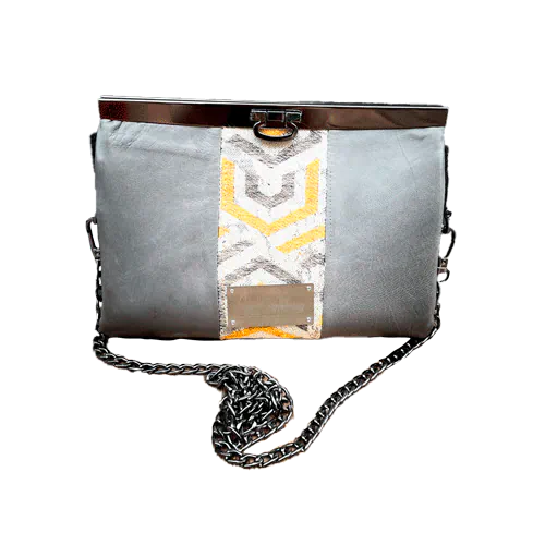 A companion made from a gray, mustard, and ecru babywearing wrap with geometric patterns and gray lambskin leather.