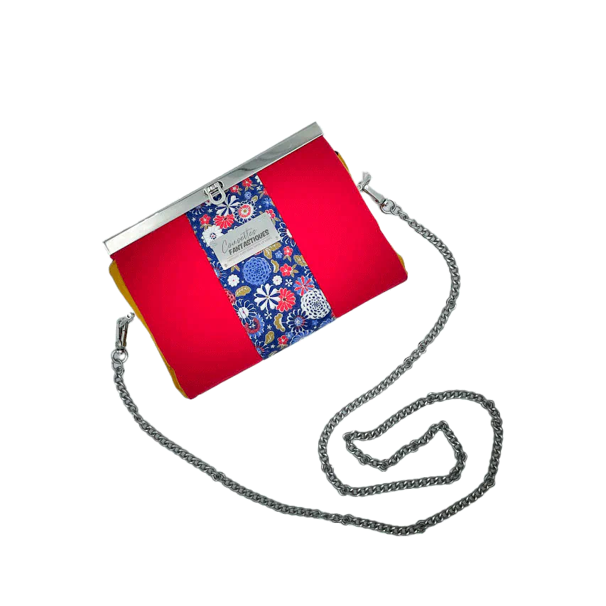 A companion made of solid red, solid yellow, and Japanese-inspired floral fabric in blue, white, red, and golden yellow.