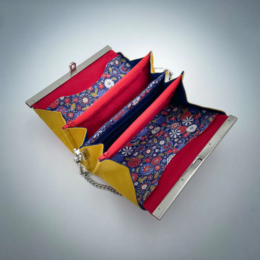 A companion made of solid red, solid yellow, and Japanese-inspired floral fabric in blue, white, red, and golden yellow.