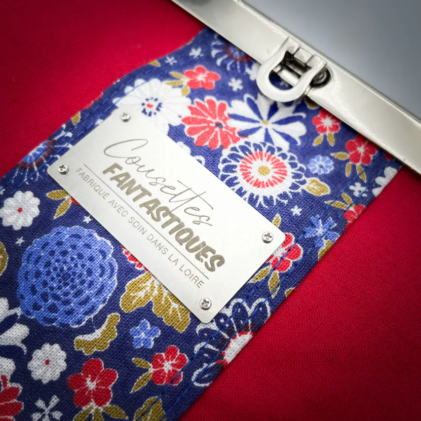 A companion made of solid red, solid yellow, and Japanese-inspired floral fabric in blue, white, red, and golden yellow.